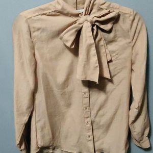 A light nudish pink blouse